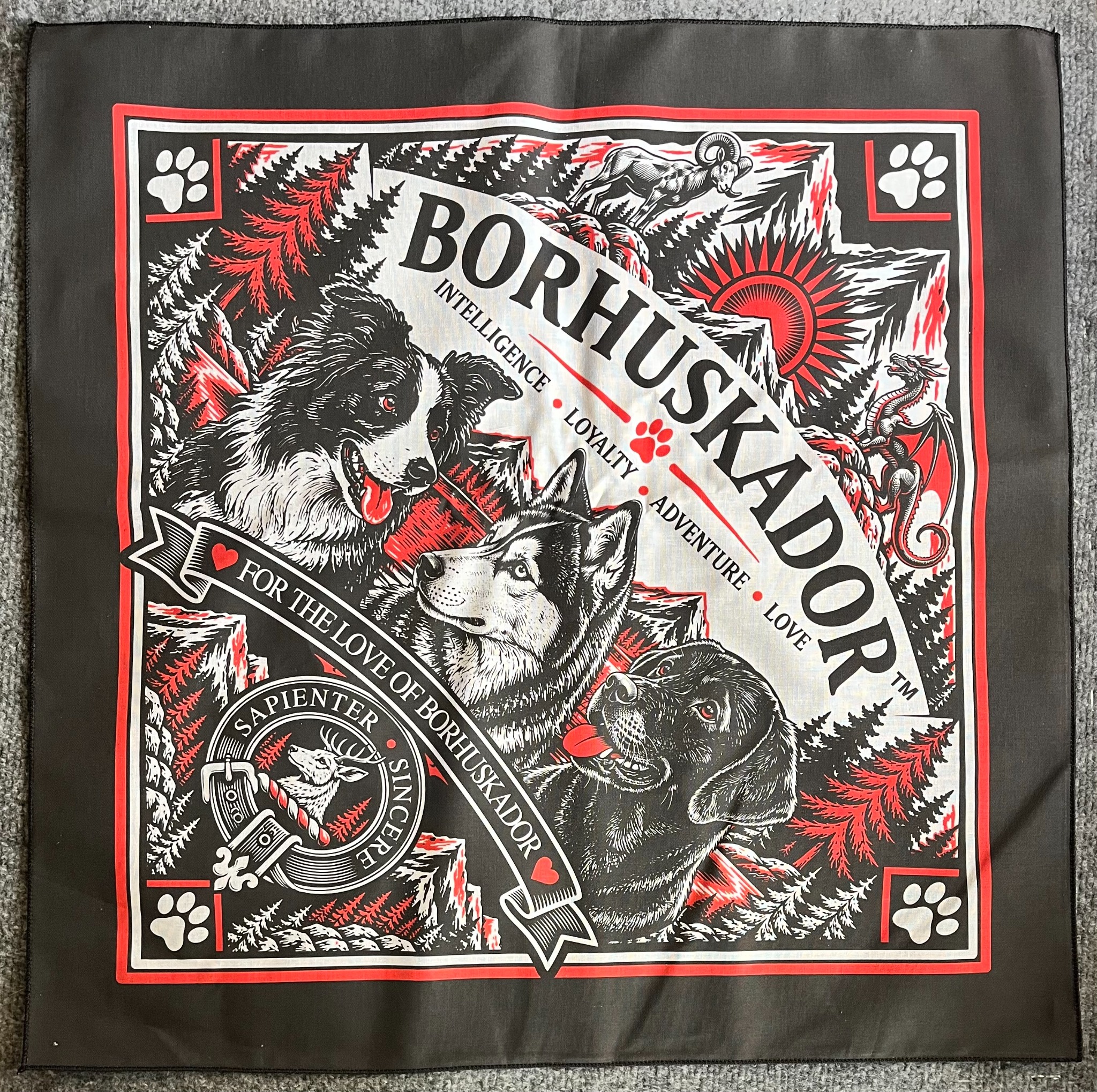 Actual BORHUSKADOR black bandana with red and white wildlife and dog design laid flat